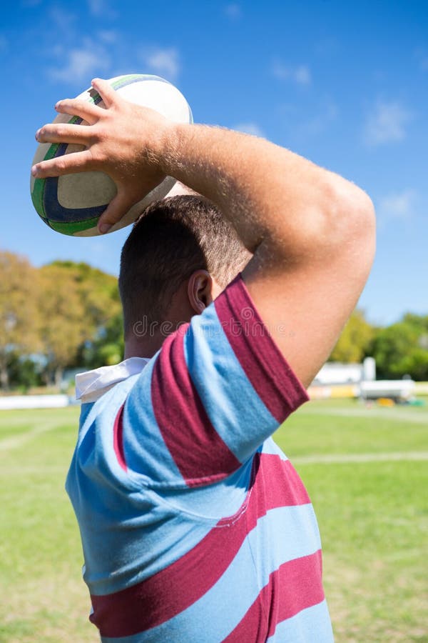 Side View of Rugby Player Throwing Ball at Field Stock Photo Image of caucasian, foreground