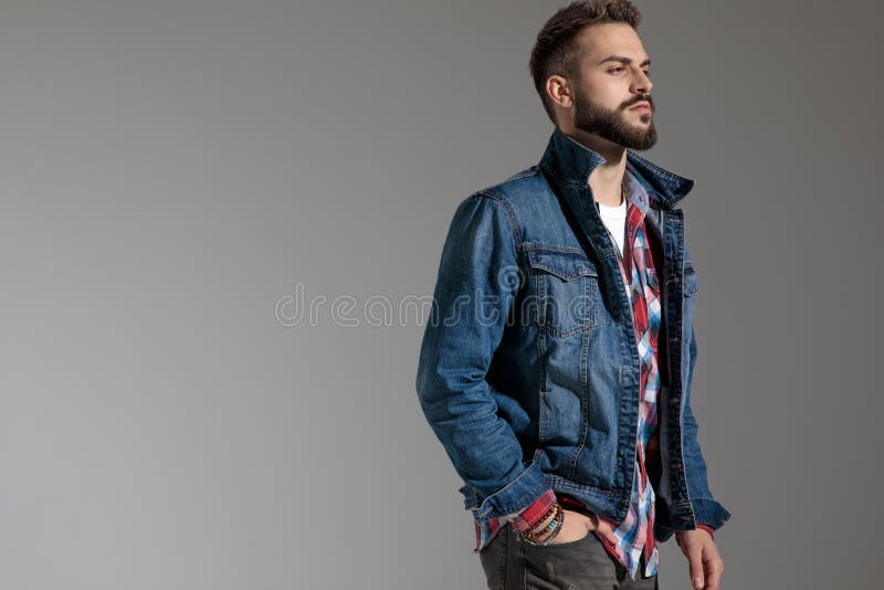 Casual Man Standing and Looking Away with Tough Attitude Stock Photo ...