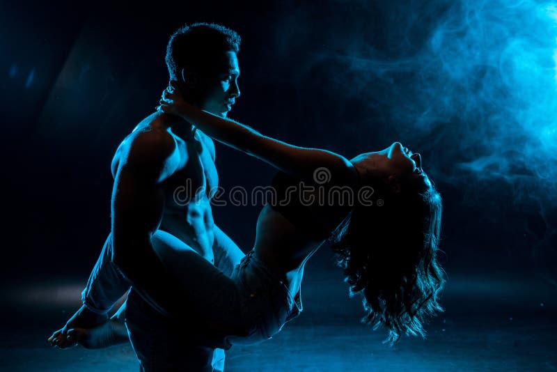 Shirtless Man Hugging Young Woman Standing in Lace Bra on Blue with Smoke.  Stock Image - Image of girl, together: 207979317