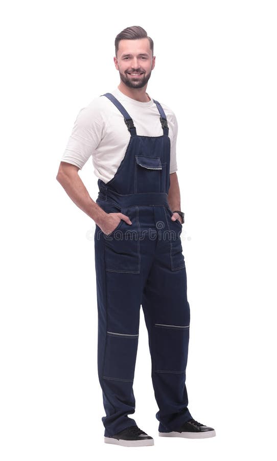 Side view. smiling man in overalls looking forward to copy space stock photography Side view. smiling man in overalls looking forward to copy space stock photography