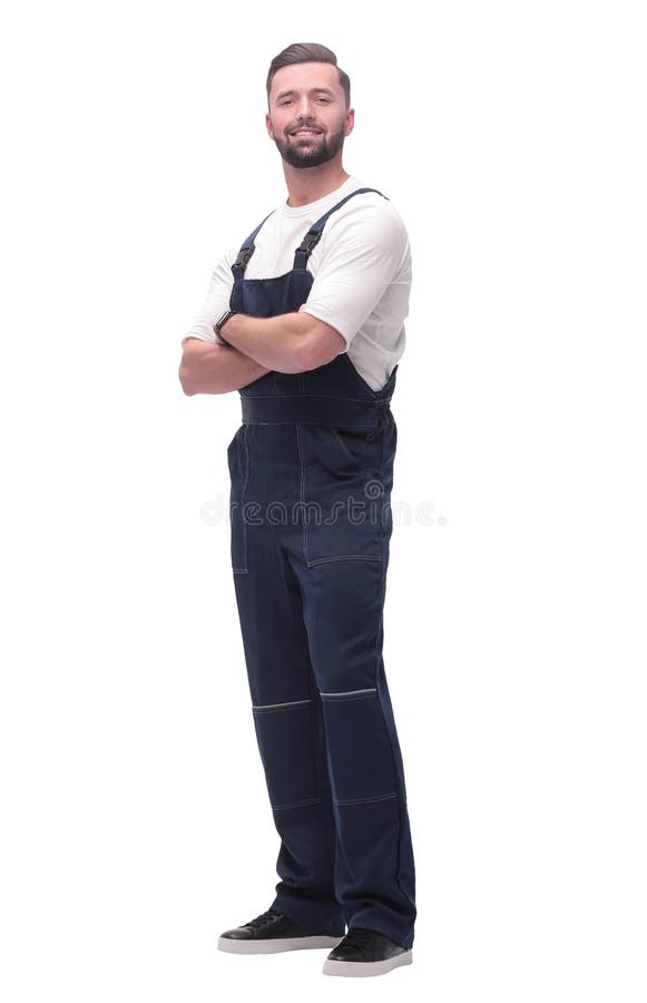 Side view. smiling man in overalls looking forward to copy space royalty free stock photography Side view. smiling man in overalls looking forward to copy space royalty free stock photography