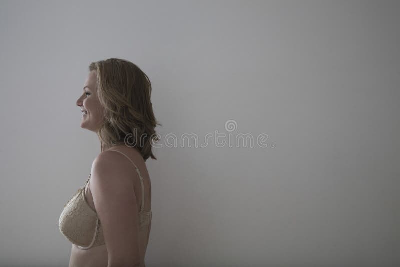 Side View of Smiling Woman in Bra Stock Photo - Image of horizontal,  copyspace: 33846902