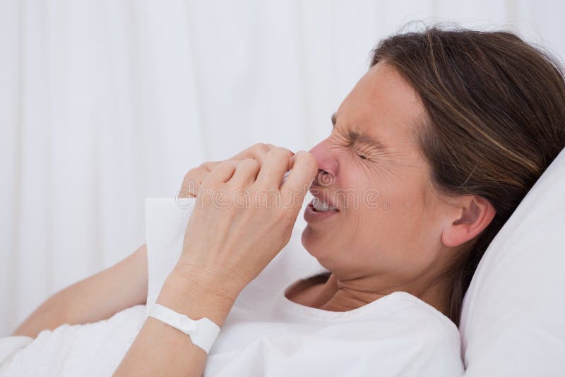 Side view of sneezing woman royalty free stock images