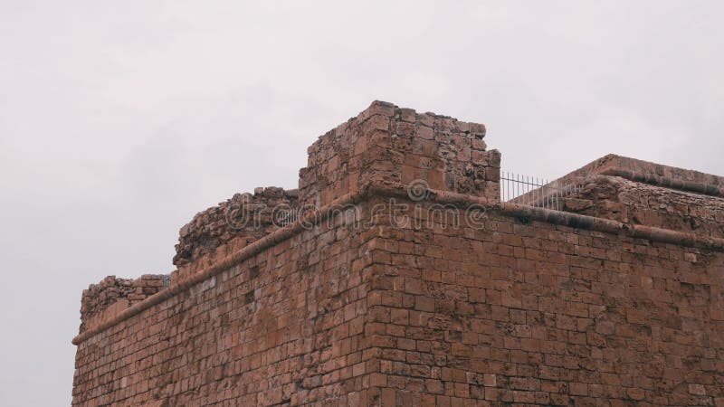 Side view of top of fortress. Side view of towers of fortress. Ruined towers of castle. Close up view of castle`s towers. Signific