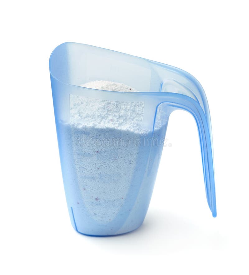 Side view of washing powder in measuring cup royalty free stock images