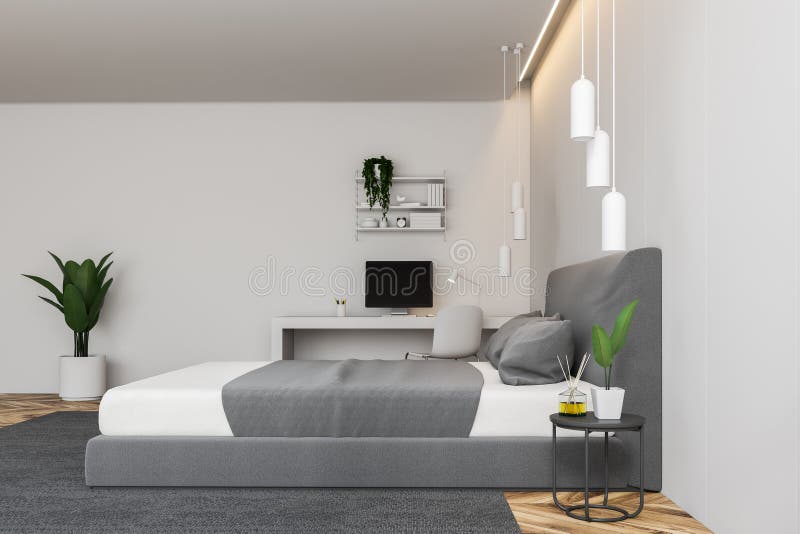Side View Of White Bedroom With Computer Desk Stock