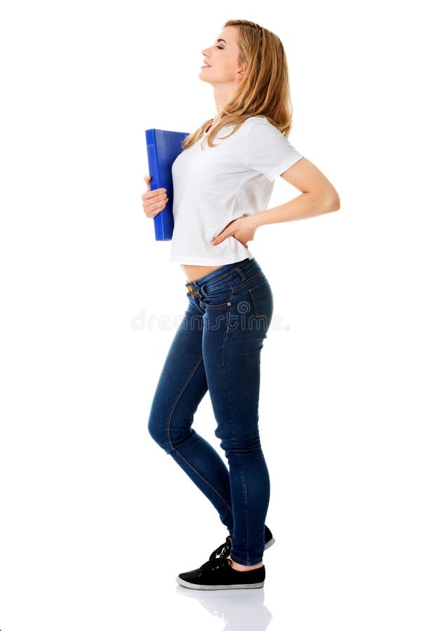 Side View of Woman with Back Pain Holding a Binder Stock Photo Image