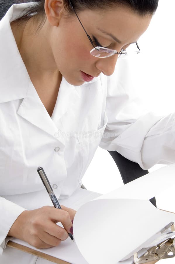 Side view of writing female doctor