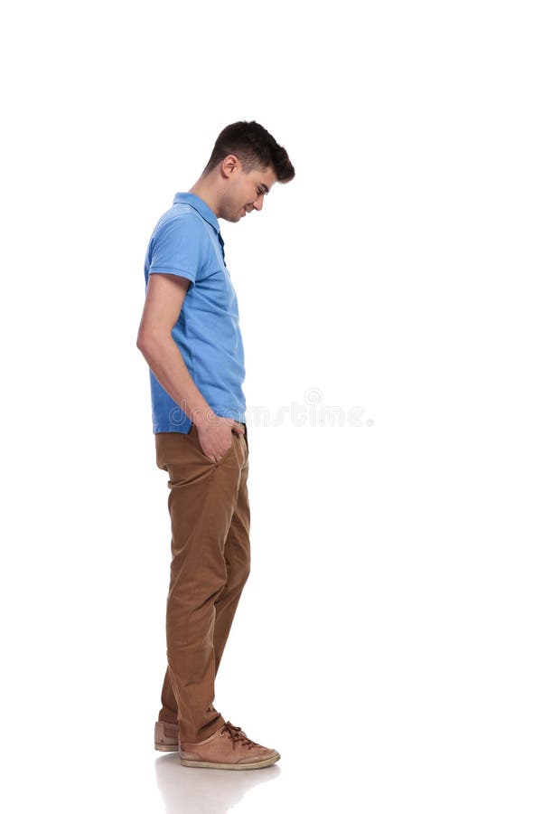 Side View Of A Young Casual Man Looking Down Stock Image - Image of