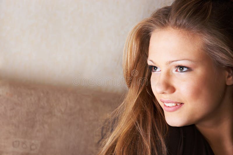 Portrait of pretty young woman with sidelong glance and scarcely perceptible smile. Portrait of pretty young woman with sidelong glance and scarcely perceptible smile