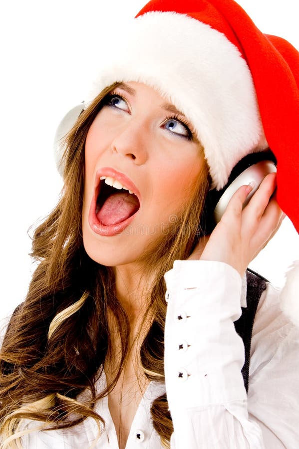 Sidepose of christmas woman listening music