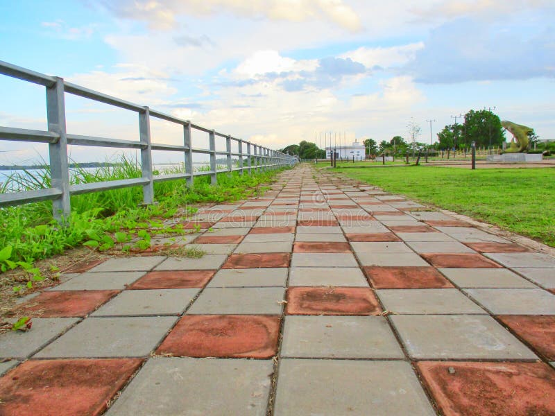 sidewalk with steel side rail, background
