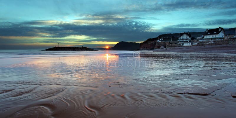 The sunsets over sidmouth beach in east devon south west england. The sunsets over sidmouth beach in east devon south west england