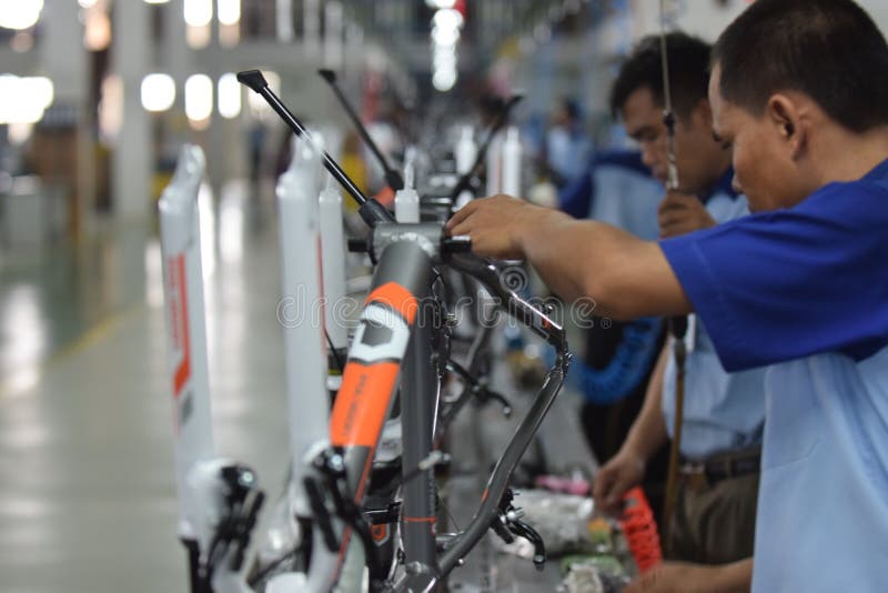 Workers Check on the Assembly Line at the Assembly Bicycle Bike