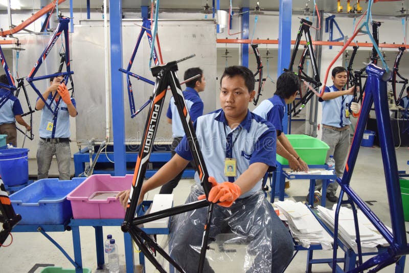 Workers Check on the Assembly Line at the Assembly Bicycle Bike