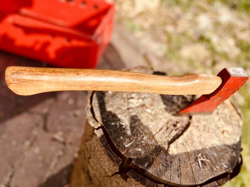 Wood axe for chopping wood, hammered into the wood stump after work is done. Wood axe for chopping wood, hammered into the wood stump after work is done.
