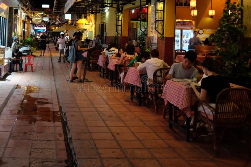 People Eat Dinner at a Cafe Outside, Night Time Editorial Photo - Image