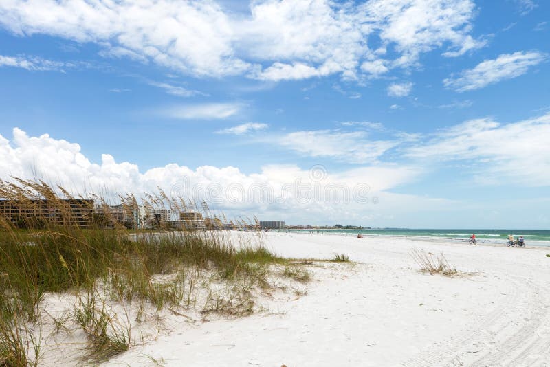 Siesta Key Beach is located on the gulf coast of Sarasota Florida with powdery sand. Recently rated the number 1 beach location in the United States. Shallow depth of field with focus on the grasses. Siesta Key Beach is located on the gulf coast of Sarasota Florida with powdery sand. Recently rated the number 1 beach location in the United States. Shallow depth of field with focus on the grasses.