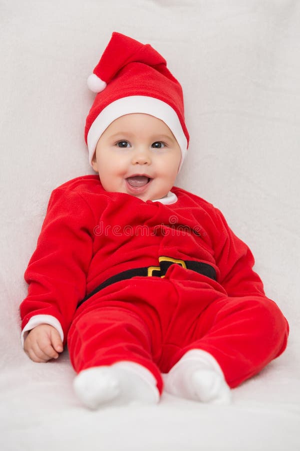 champú Registro Australia Siete Meses Del Bebé En El Vestido De Santa Claus Imagen de archivo -  Imagen de manos, adorable: 81424301