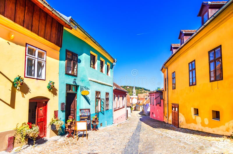 Sighisoara, Romania: Famous stone paved old streets with colorful houses in the medieval city-fortress royalty free stock photo Sighisoara, Romania: Famous stone paved old streets with colorful houses in the medieval city-fortress royalty free stock photo