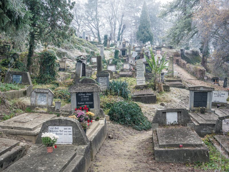 Sighisoara Romania - 11.26.2020: Graves and tombstones in the cemetery located near Church on the Hill in Sighisoara