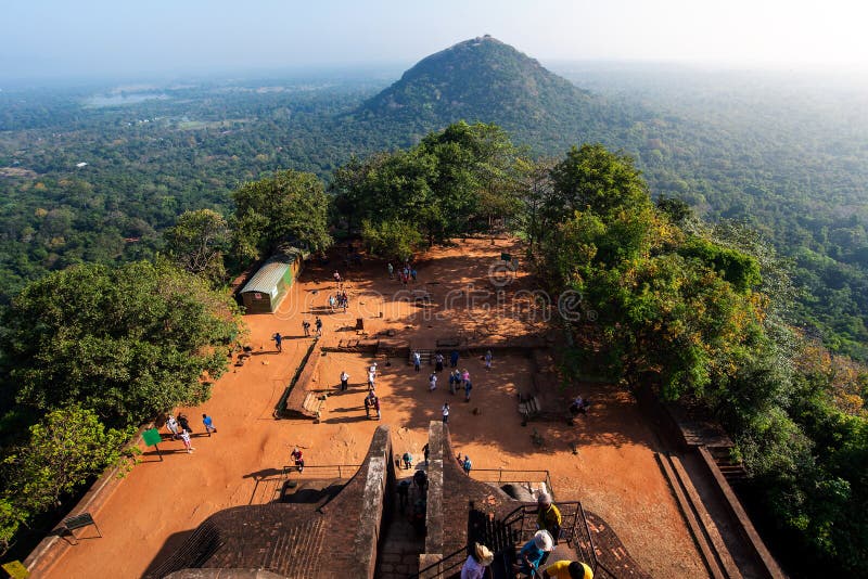 Sigiriya, Sri Lanka - March 31, 2019: Sigiriya ancient Lion rock fortress in Sri Lanka with tourists royalty free stock image Sigiriya, Sri Lanka - March 31, 2019: Sigiriya ancient Lion rock fortress in Sri Lanka with tourists royalty free stock image