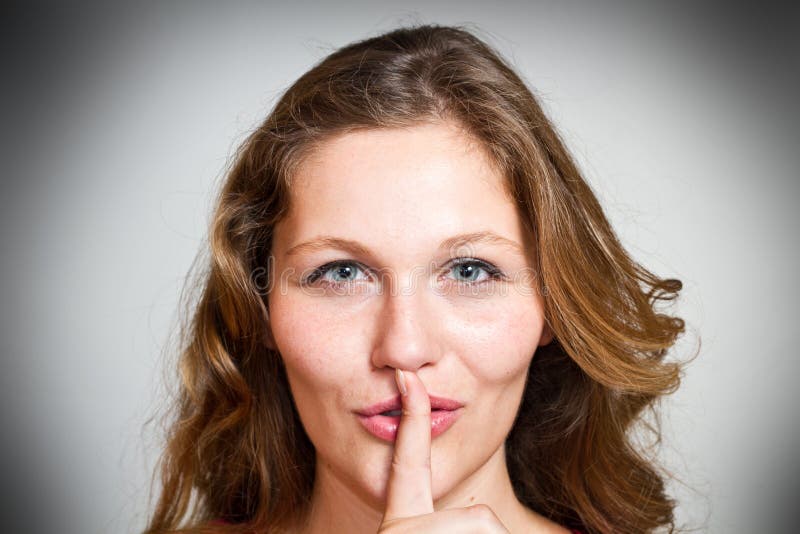 A sign of being quiet- hush stock photos