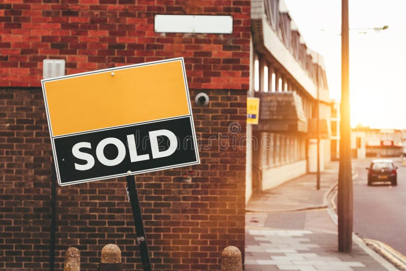 Sign on a Brick Wall with Sold Written on it Stock Photo Image of