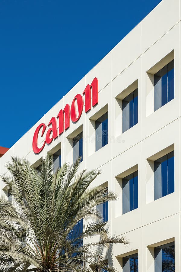 Sign of Canon on the Office Building in Dubai Editorial Stock Photo