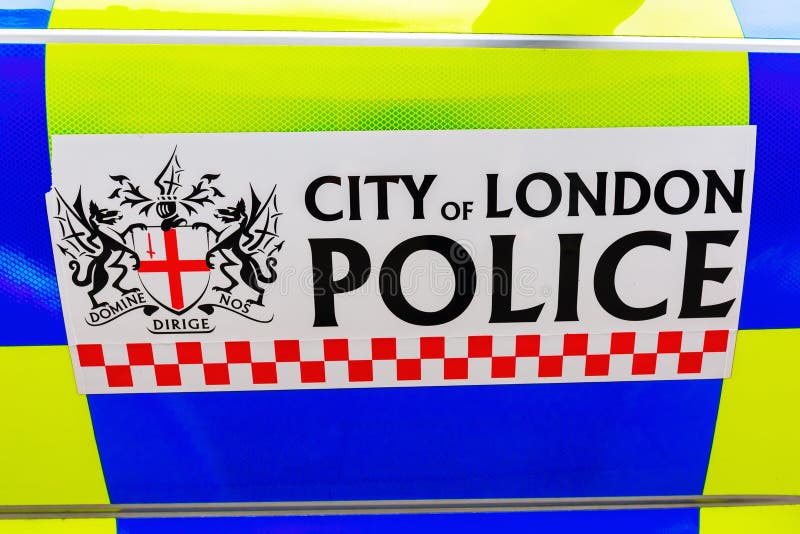 Sign of the City of London Police at a police car