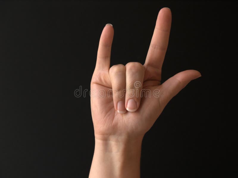 A woman's hand doing sign language for I LOVE YOU. A woman's hand doing sign language for I LOVE YOU