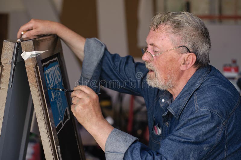 Sign Painter Working stock image. Image of adult, commercial 2140213
