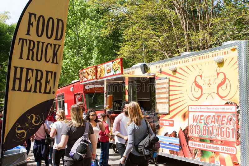 Sign Promotes Presence of Food Trucks at Atlanta Festival Editorial