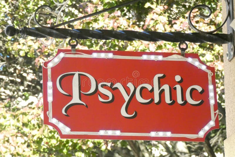 An illuminated sign with the word Psychic. An illuminated sign with the word Psychic.