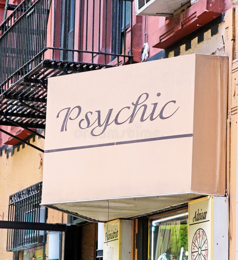 Psychic Sign on a pink board in a street in NYC. Psychic Sign on a pink board in a street in NYC.