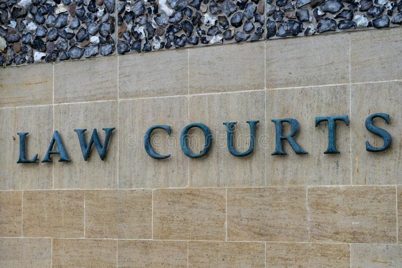 A Sign Reading Law Courts in the Exterior of a Building Stock Photo