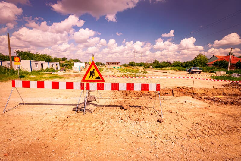 Sign with Symbol of Warning at Construction Zone Area Stock Image