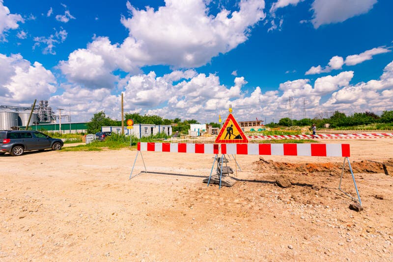 Sign with Symbol of Warning at Construction Zone Area Stock Photo