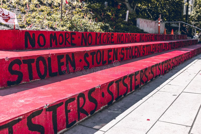 A sign with text `No more stolen sisters` on the Robson Square. Memorial to honour Missing and Murdered Indigenous Women in US and