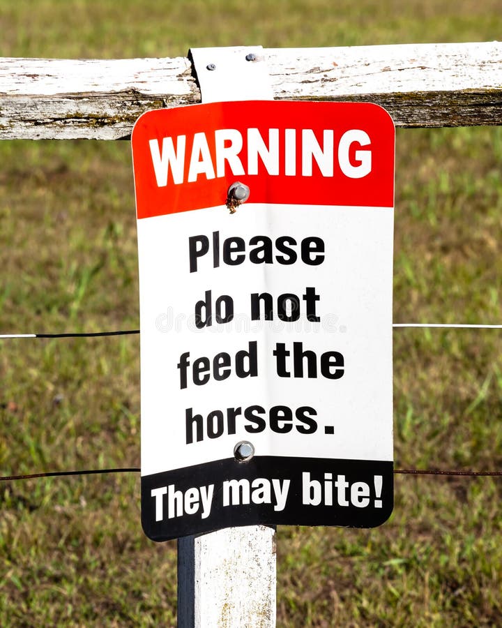 Sign Warning Please Do Not Feed The Horses. They Bite! Stock Image
