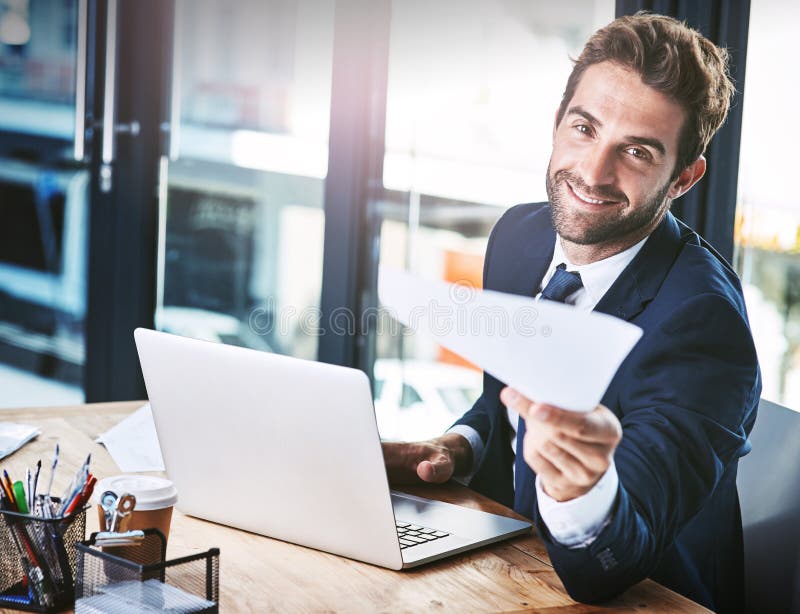 Sign this and were good to go. Cropped portrait of a handsome young businessman handing you a document with a smile on