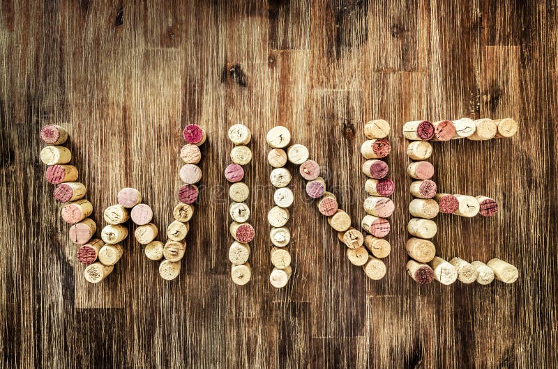 Sign wine made from corks on wooden vintage table