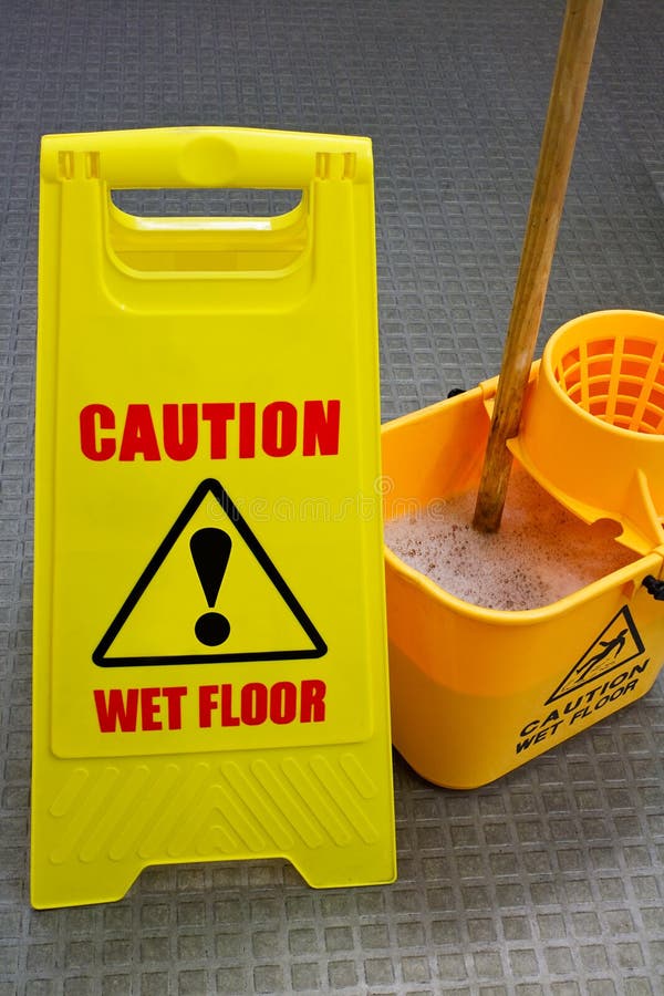 Caution wet floor sign with mop and bucket. Caution wet floor sign with mop and bucket