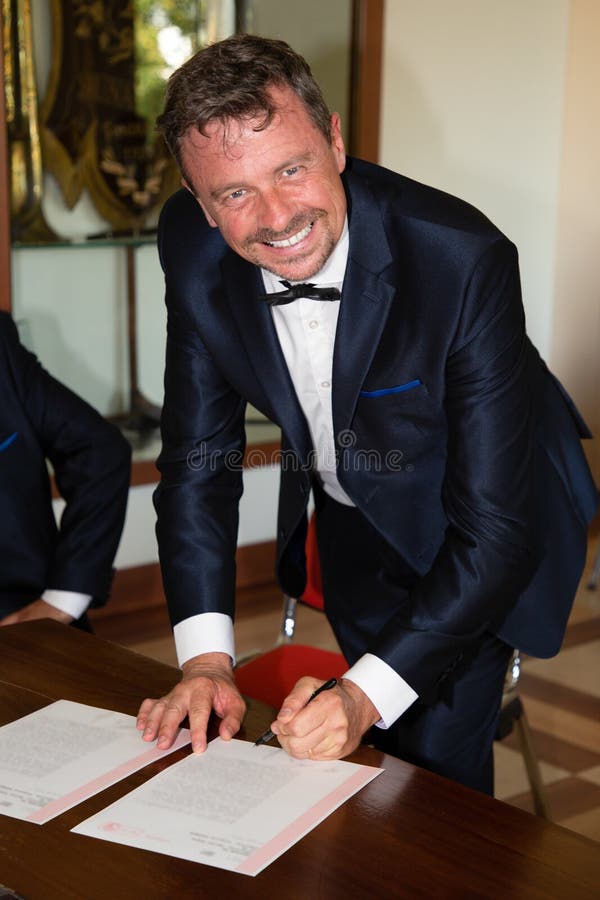 Signature of the groom man signing marriage contract royalty free stock image