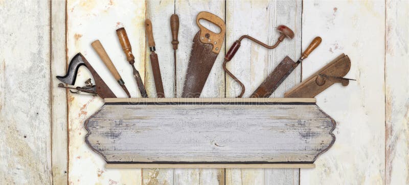 Signboard and carpenter tools on wooden background royalty free stock photography