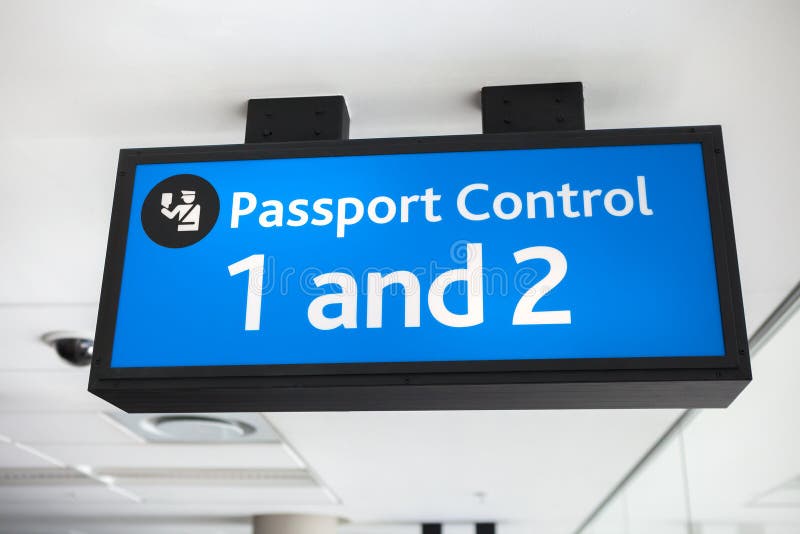 Generic blue passport control sign at airport - landscape interior. Generic blue passport control sign at airport - landscape interior