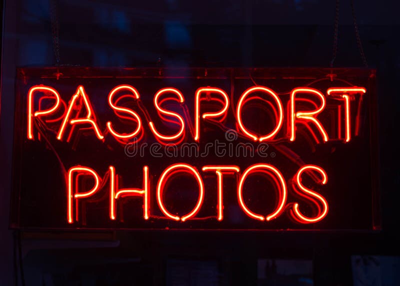 A sign advertising Passport Photos. A sign advertising Passport Photos