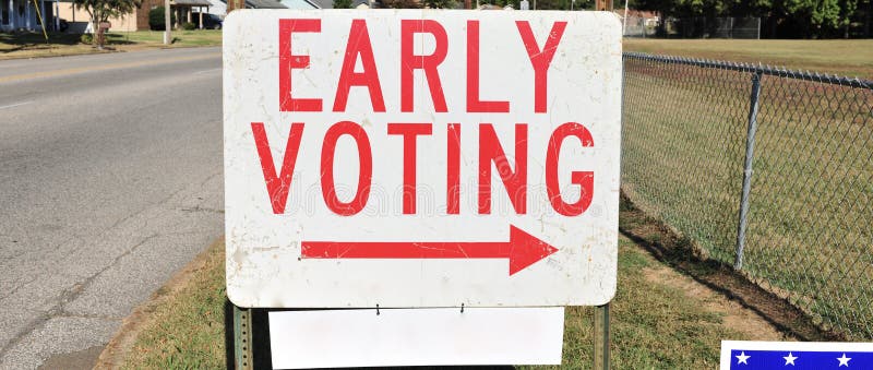 An early voting sign pointing towards a location where people can vote early for an election. An early voting sign pointing towards a location where people can vote early for an election.