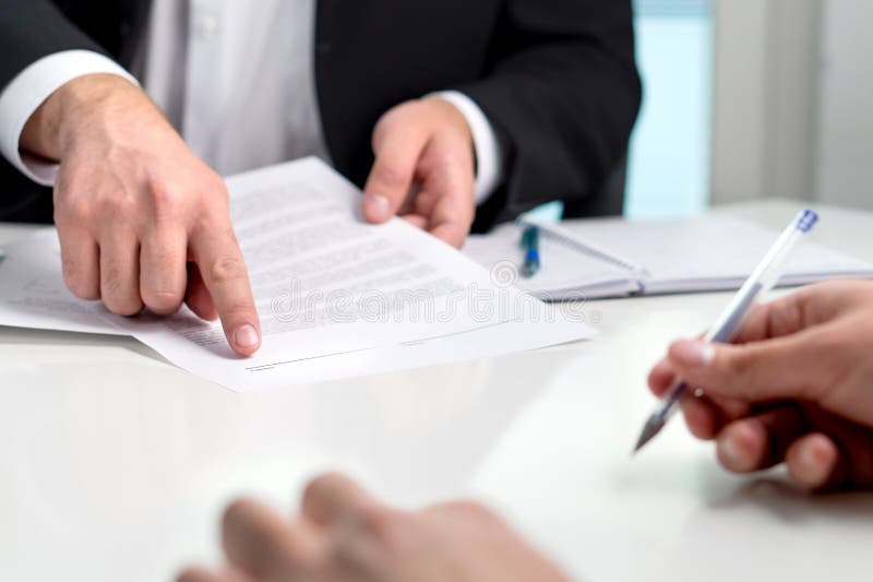 Signing a contract or agreement. stock photos