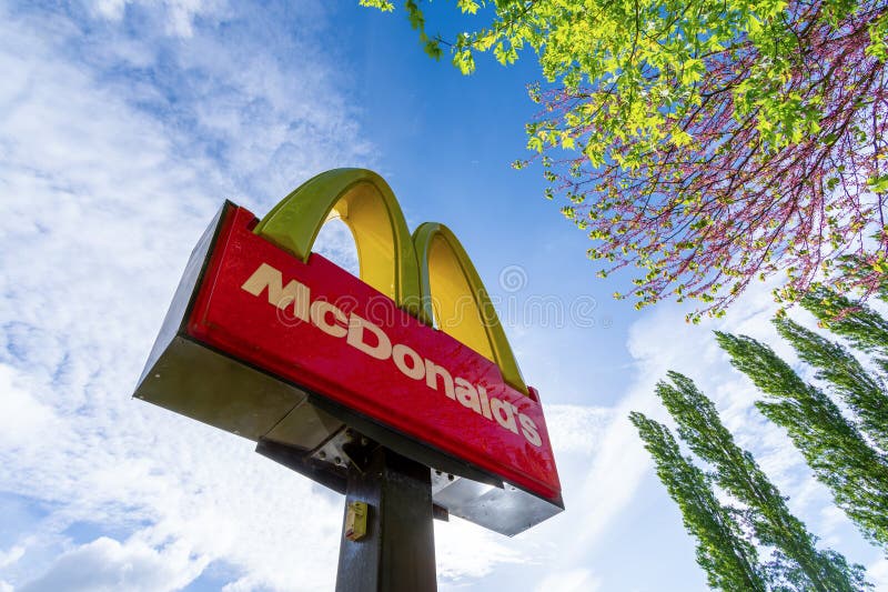 Villers-Saint-Paul, France - May 3, 2024: Sign and logo of a McDonald's restaurant. McDonald's Corporation is an American fast food multinational company with a worldwide presence. Villers-Saint-Paul, France - May 3, 2024: Sign and logo of a McDonald's restaurant. McDonald's Corporation is an American fast food multinational company with a worldwide presence